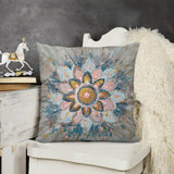 Plush pillow cover with abstract floral art in pink, yellow, blue; sofa, couch, living room decor.