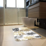 Tropical leaves entrance doormat in bathroom, gold and gray leaves design, rubber floor mat.