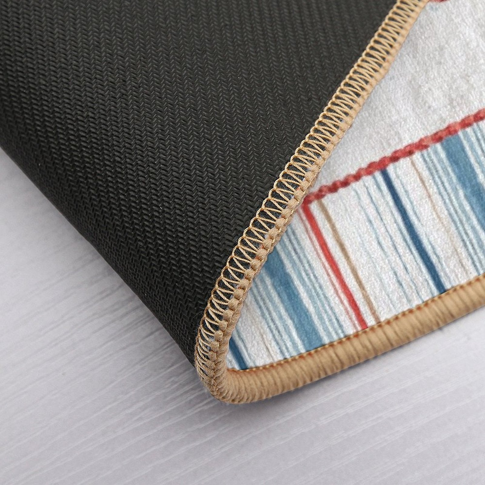 Nautical striped floor mat close-up, washable rug, with a non-slip back, perfect for bedroom or bathroom.