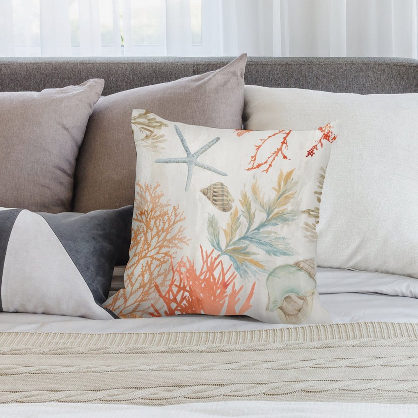 Plush pillow cover with watercolor starfish, seashells, and coral design; decorative pillow.