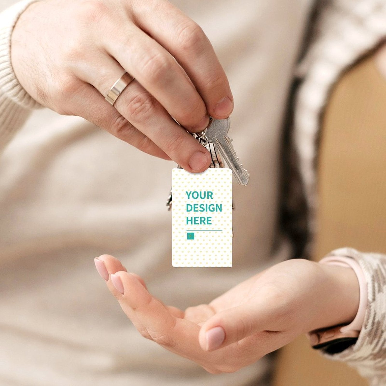 Personalized acrylic keychain with 'YOUR DESIGN HERE' design, perfect for custom gifts, attached to keys