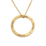 Gold circle pendant necklace with engraved names, a personalized jewelry gift.