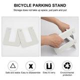 White PVC balance bike parking stand, easy assembly and storage, eco-friendly design, heart pattern for kids.