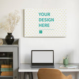 Custom canvas print with 'YOUR DESIGN HERE' text, perfect for wall art from MyArtsyGift.com, displayed on a wall
