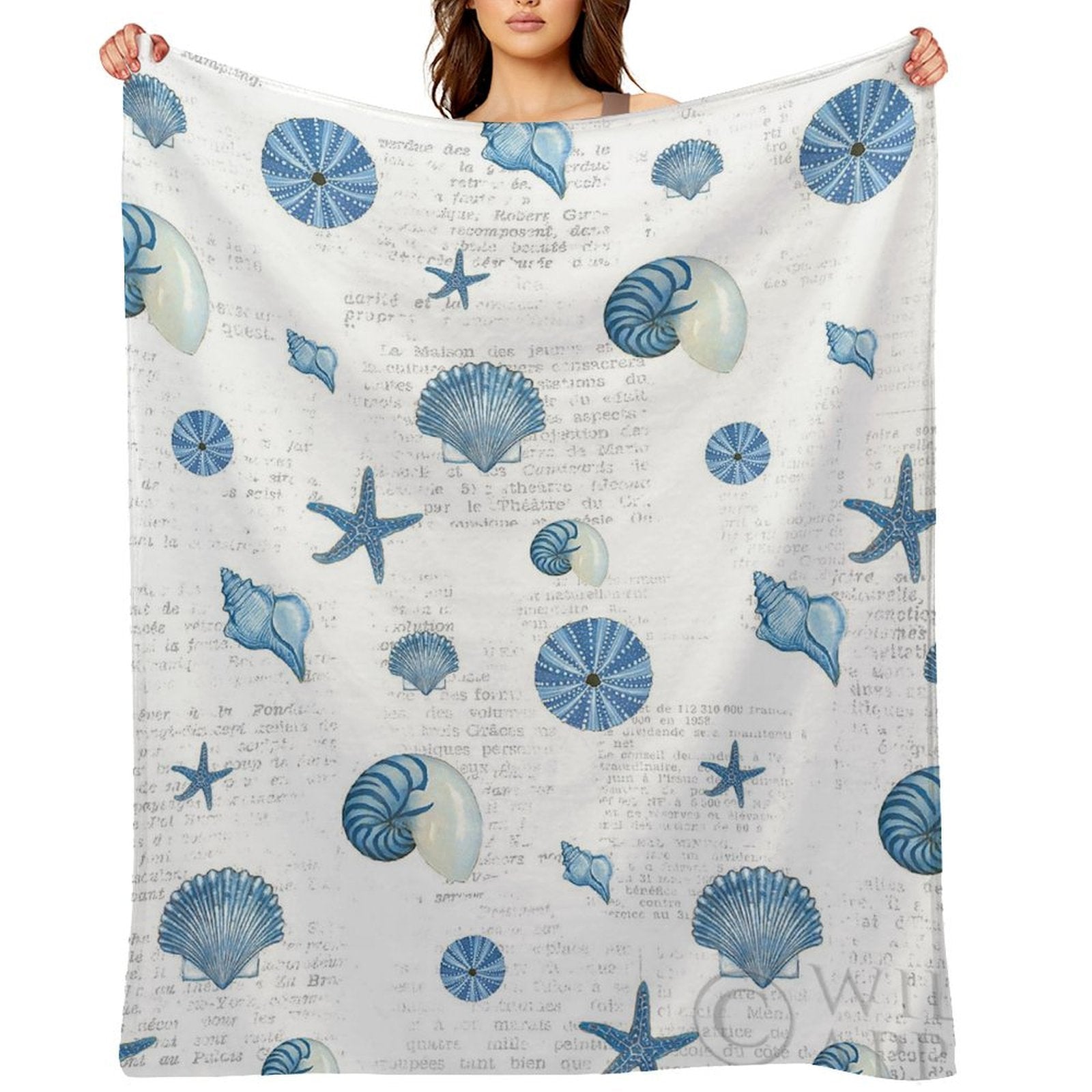 Navy shells fleece blanket featuring seashells and starfish design, cozy and soft for bed or sofa