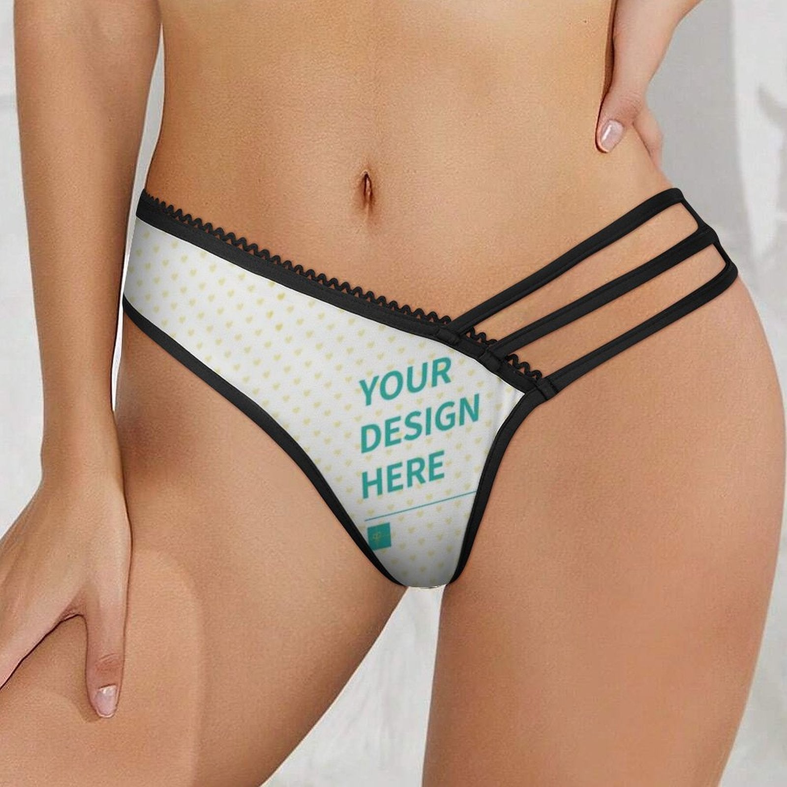Custom women's underwear with 'YOUR DESIGN HERE' on white, black trim, personalized panties