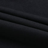 Black cotton fabric detail for youth hoodie, showcasing soft texture and material quality