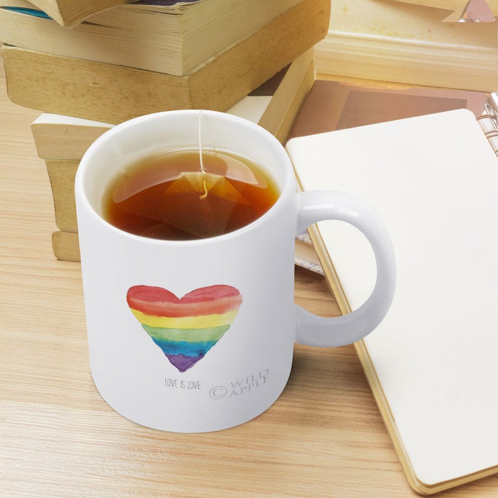 White ceramic coffee mug with rainbow heart, 'Love is Love' design, perfect Pride gift