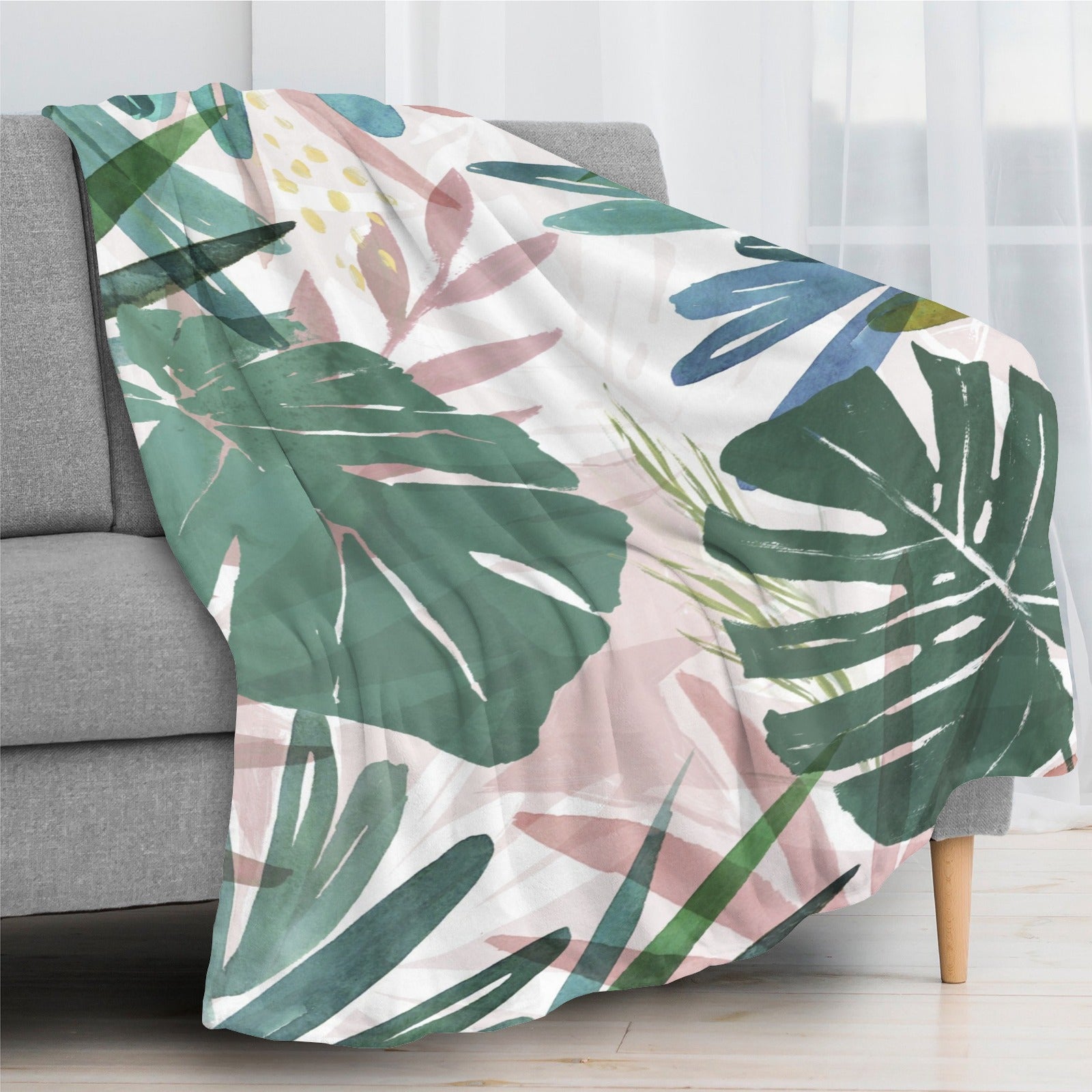 Tropical plants flannel blanket on sofa, green palm leaves watercolor design, home decor
