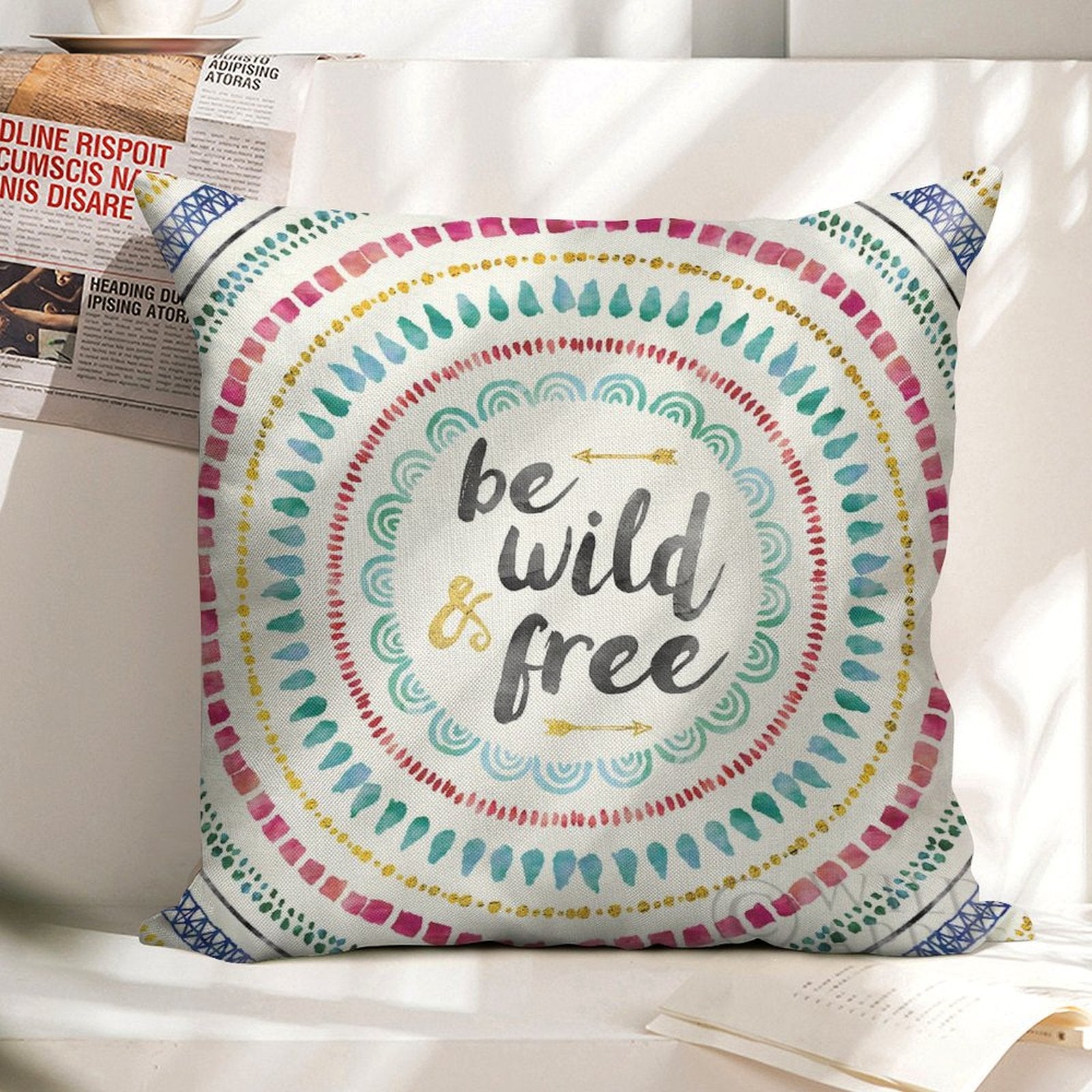 Linen pillow case with colorful mandala design and "be wild & free" text, home decor.