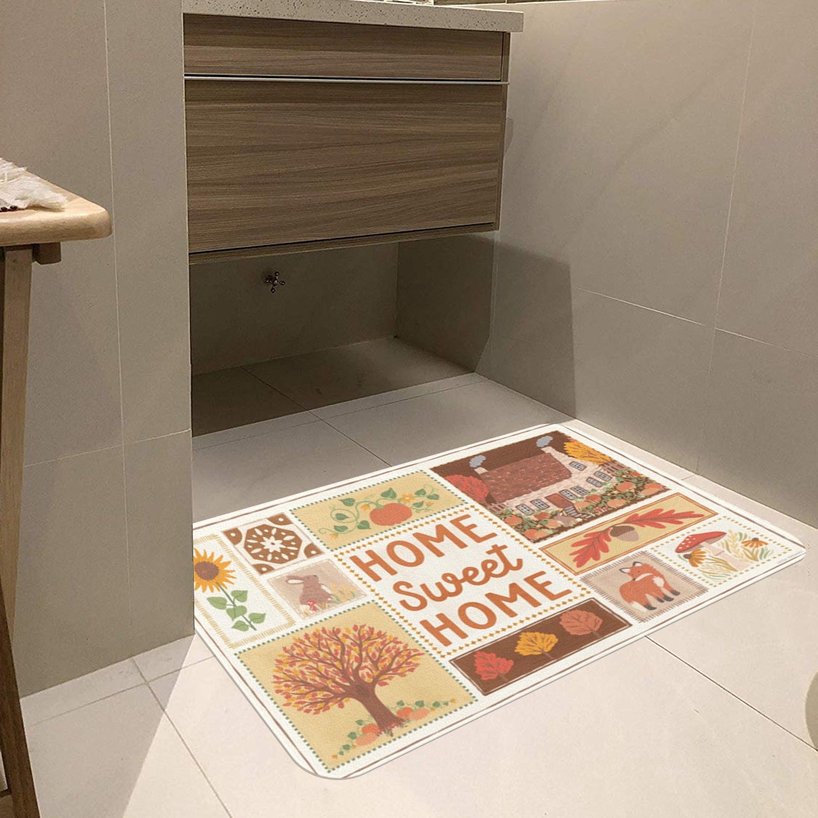 Autumn entrance doormat with "Home Sweet Home" design and fall motifs, rubber floor mat for indoor/outdoor use.