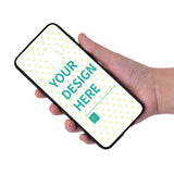 Custom Samsung Galaxy S9 case with 'YOUR DESIGN HERE' text, heart pattern design, black TPU case.