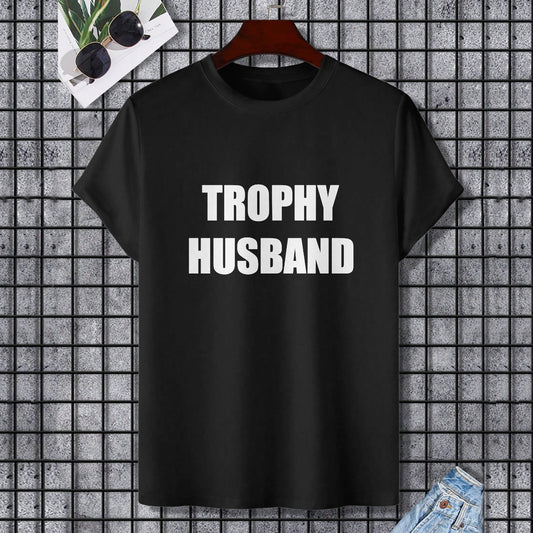 Black Gildan unisex T-shirt with "TROPHY HUSBAND" printed in white, perfect for expressing individuality