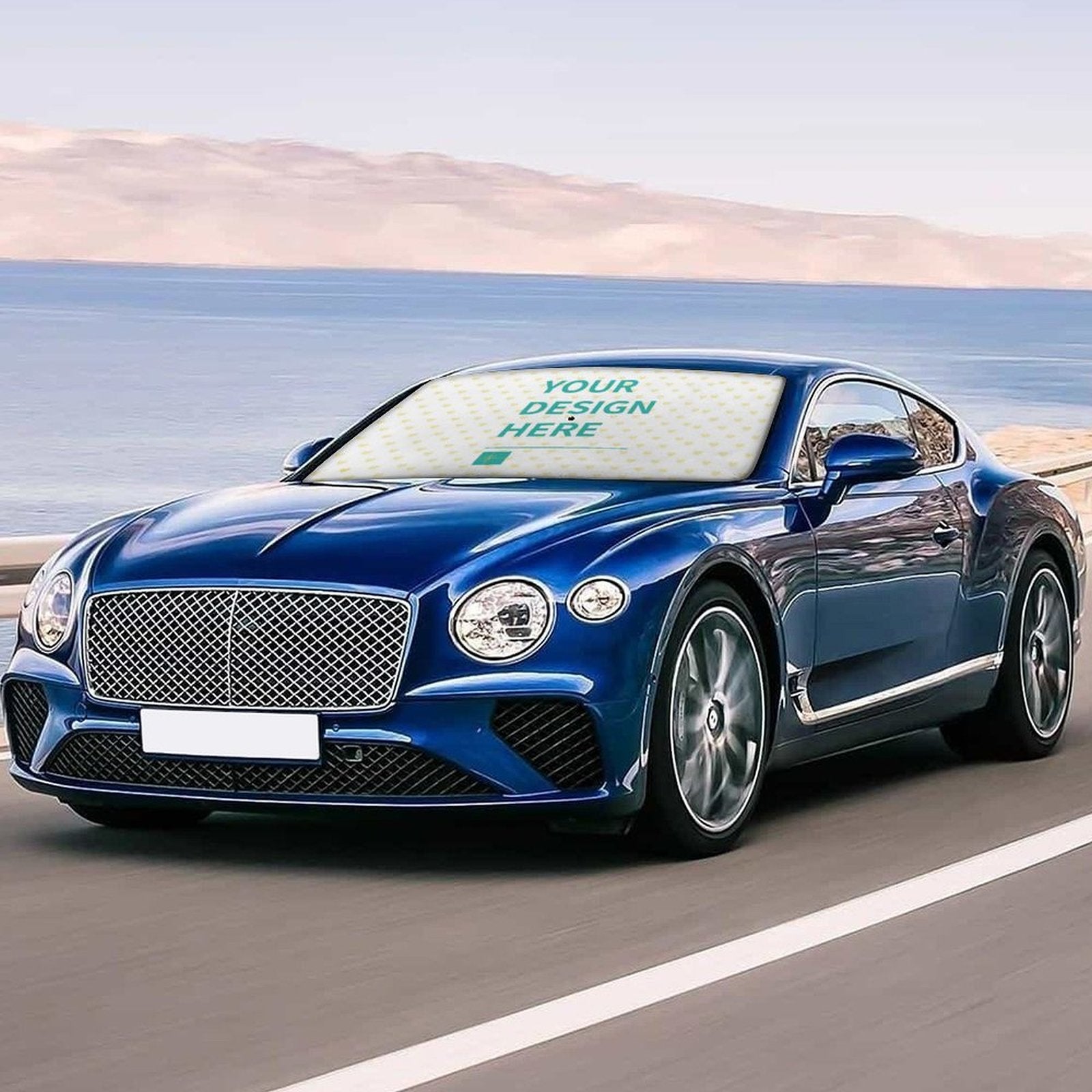 Custom car sunshade for front windshield featuring customizable design, text "YOUR DESIGN HERE", made of PG Cloth, blue car.