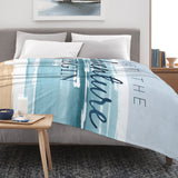 Blue Beach Coastal Flannel Blanket with 'Let The Adventure Begin' text, perfect for sofa or bed
