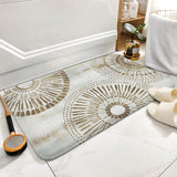 Coral velvet bath rug with sunburst design for bathroom, non-slip and absorbent, stylish floor carpet.