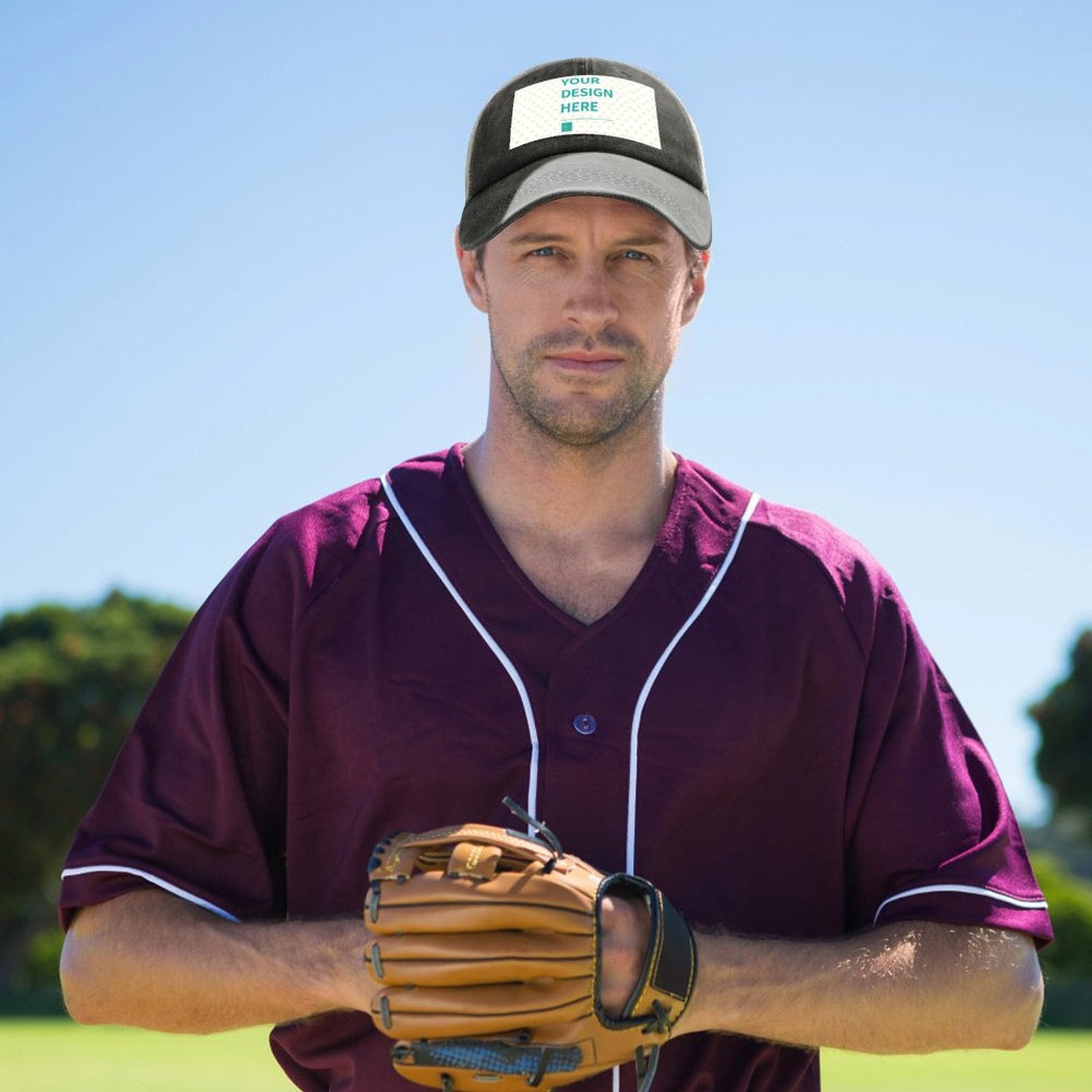 Custom baseball cap with 'YOUR DESIGN HERE' on a man in a baseball uniform; design your own hat