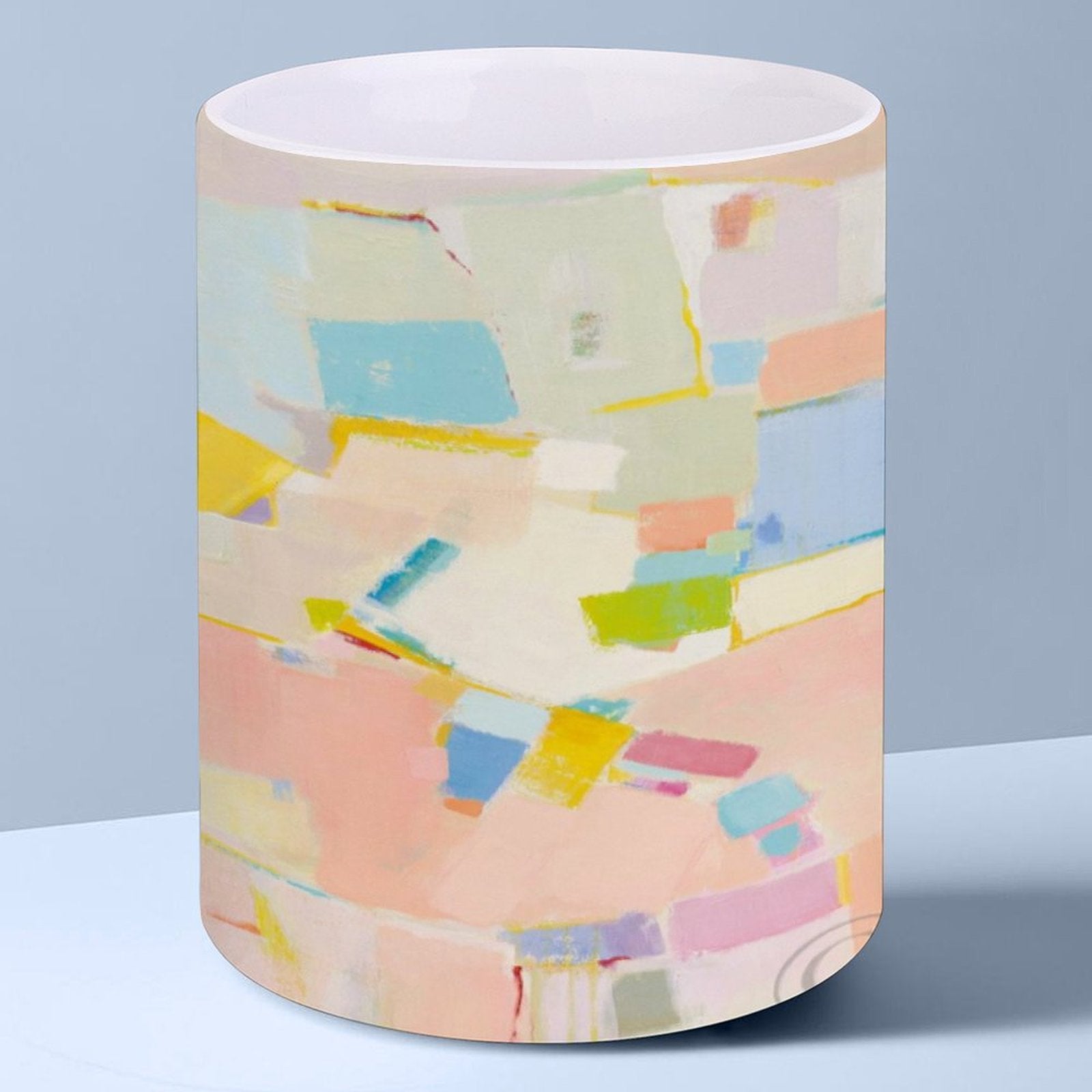 Customizable white ceramic mug with colorful abstract art design, perfect gift for home or office use.