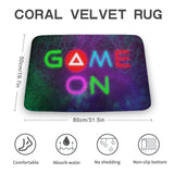 Coral velvet rug with vibrant neon 'GAME ON' design, ideal for bathrooms. Non-slip, quick-drying floor carpet.