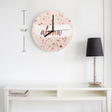 Pink MDF wall clock with 'aloha' text for living room, office decor. Modern terrazzo pattern.