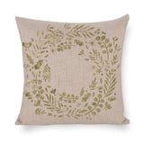 Cotton linen pillow case with gold botanical wreath, perfect for bedroom or living room decor.