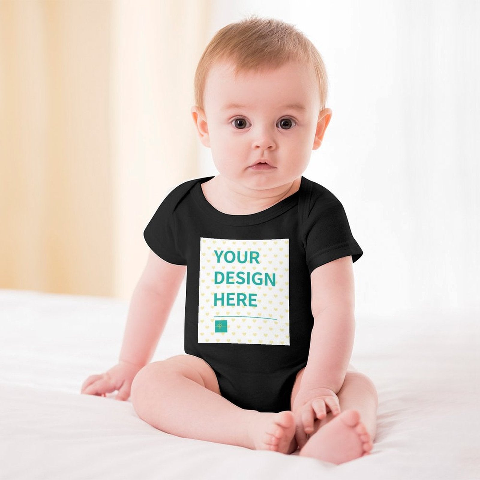 Custom baby bodysuit, featuring 'YOUR DESIGN HERE' design on a black cotton bodysuit