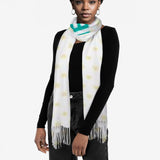 Woman wearing a custom imitation cashmere scarf with a unique design, perfect winter shawl.