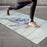 Watercolor blue sea turtle yoga mat with person in yoga pose; non-slip surface