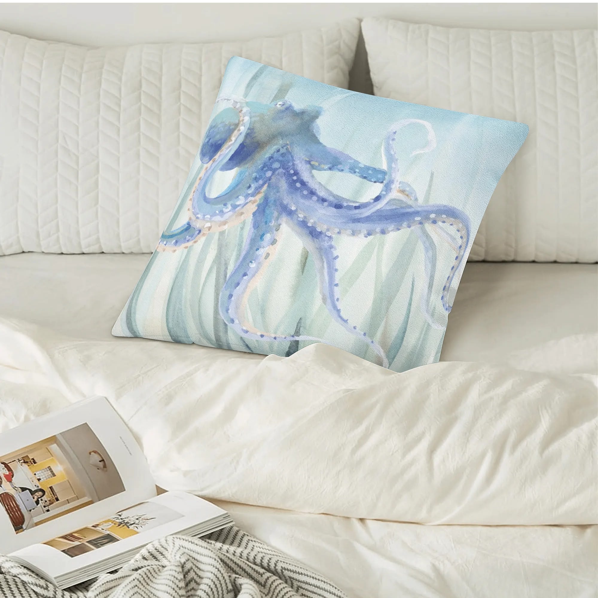 Blue octopus watercolor pillow cover on white bed, home decor