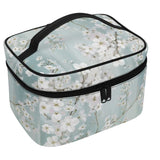Plum Blossom Makeup Bag for women. PU leather cosmetic bag with a floral design and a black zipper.