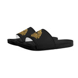 Black flip flops with gold glitter design, perfect for summer beach wear.