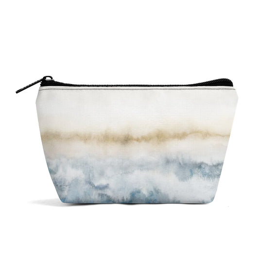 Girls' wristlet bag with an abstract watercolor design in blue and tan.