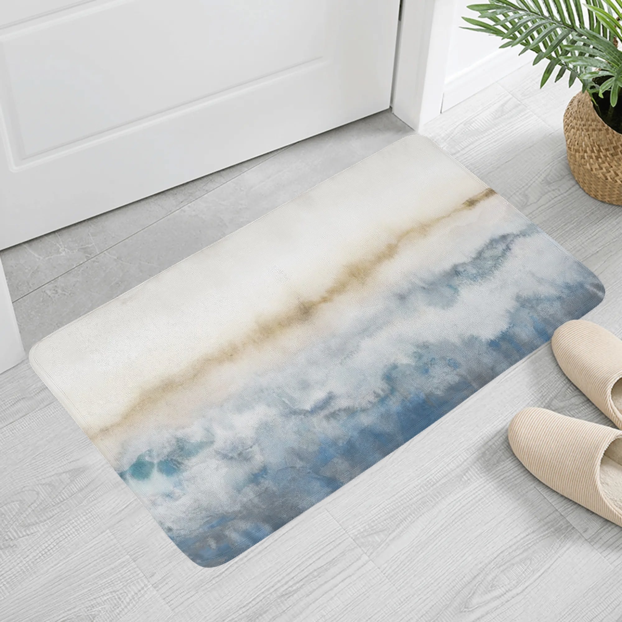 Abstract art doormat with blue and brown pattern in front of a white door