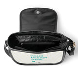 Customizable PU leather saddle bag open, showing interior, with 'YOUR DESIGN HERE' design. Black bag for women.