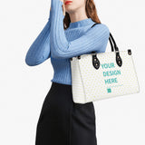 Customizable PU leather handbag with heart pattern, black handles, and text "YOUR DESIGN HERE" work bag