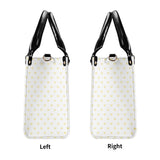 Personalized PU leather handbag, white with yellow heart pattern, black handles and straps. Left and Right view.