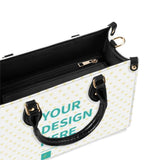 Personalized white PU leather tote bag with 'YOUR DESIGN HERE' text, black handles, and a heart pattern; perfect gift