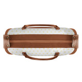 Foldable travel duffel bag with heart pattern and brown leather accents, perfect travel gift.