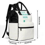Personalized mummy backpack with 'YOUR DESIGN HERE', white with yellow hearts, black accents, diaper bag.