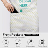 Customizable white cooking apron with pockets, heart pattern, and 'DESIGN HERE' text; perfect for kitchen and BBQ.