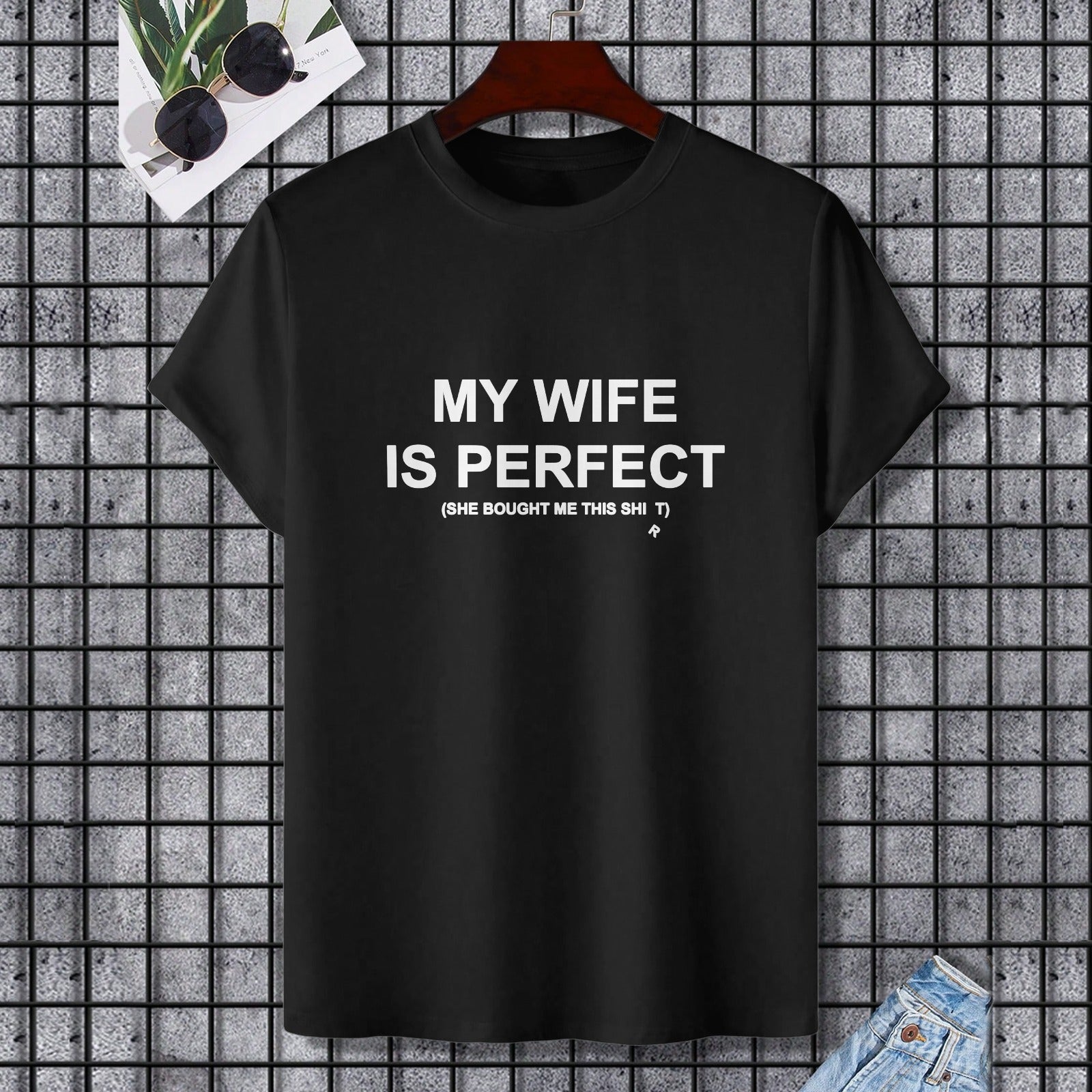 Black cotton t-shirt with 'MY WIFE IS PERFECT' text. Gildan unisex tee, perfect gift for wife. Shop at MyArtsyGift.com