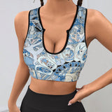 Artistic patterned sports bra, U-neck, for yoga and workouts. Featuring figures in athletic poses, comfortable and stylish.