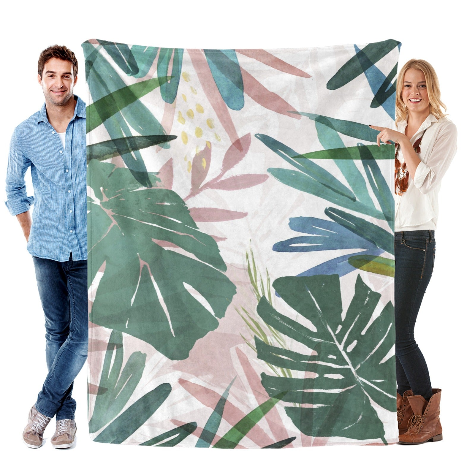 Tropical Plants Green Palm Leaves Flannel Blanket, made in USA, held by people. Soft, cozy and stylish