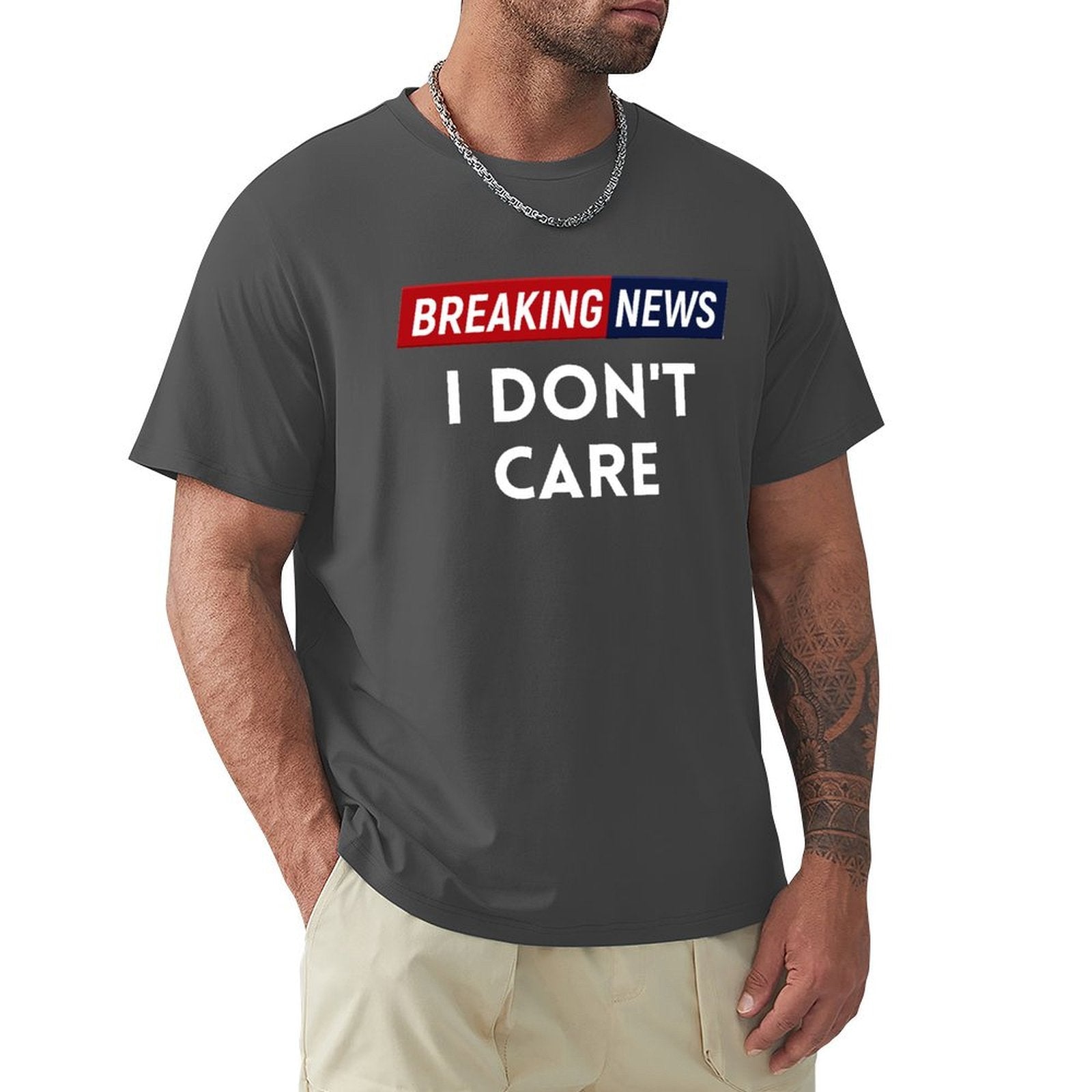 Men's black crew neck t-shirt with "BREAKING NEWS I DON'T CARE" graphic, comfortable cotton tee