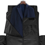 Foldable black garment bag with a navy suit jacket, perfect travel luggage for men and women.