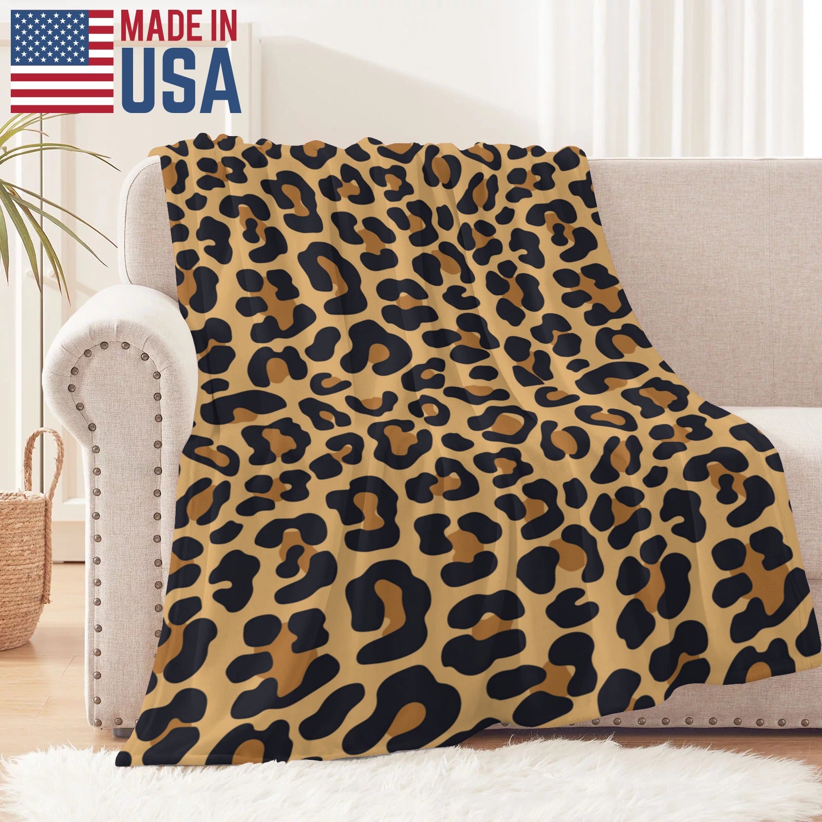 Leopard print flannel blanket made in USA, soft and cozy for home decor, features black, brown spots.