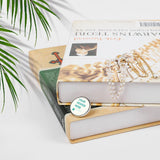 Custom round alloy lapel pin with 'YOUR DESIGN HERE' on books and jewelries, personalized gift.