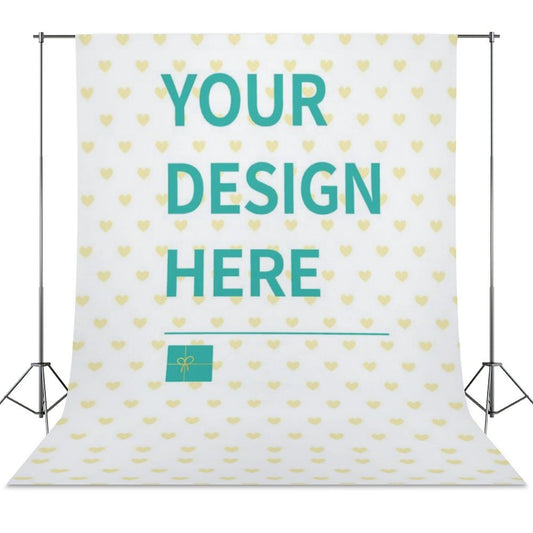 Custom Photography Cloth with 'YOUR DESIGN HERE' message, white background with yellow hearts, supported by a black tripod