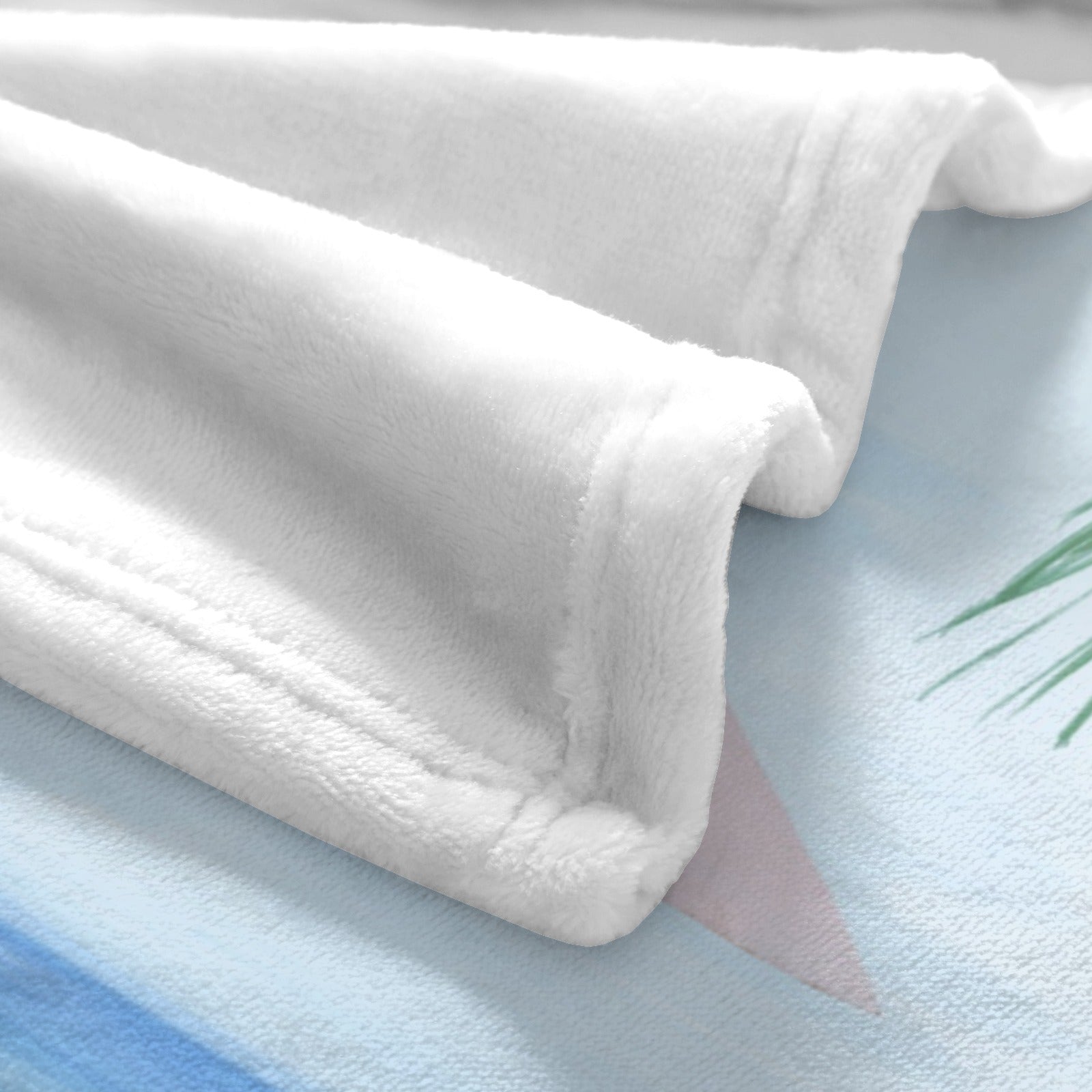 White summer beach flannel blanket closeup, soft polyester, perfect for sofa or bed. Stylish, lightweight and made in USA