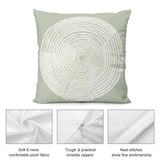 Light green throw pillow with white tree ring design, soft plush fabric, invisible zipper, and neat stitching.